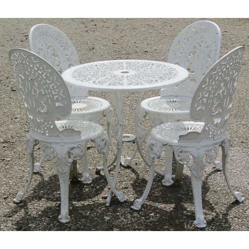 194 - A small cream painted cast aluminium garden terrace table with decorative circular pierced scrolling... 