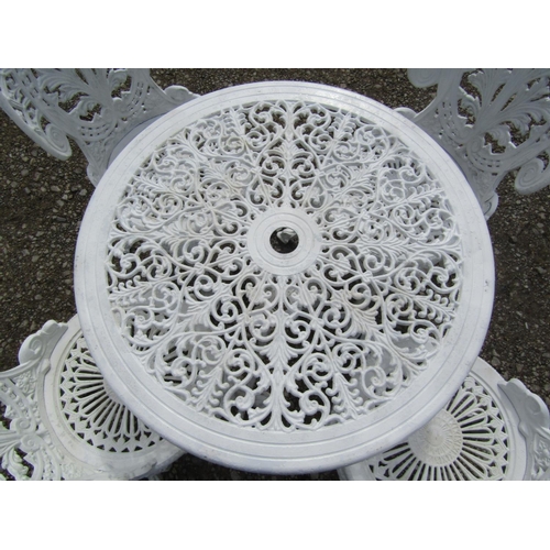 194 - A small cream painted cast aluminium garden terrace table with decorative circular pierced scrolling... 