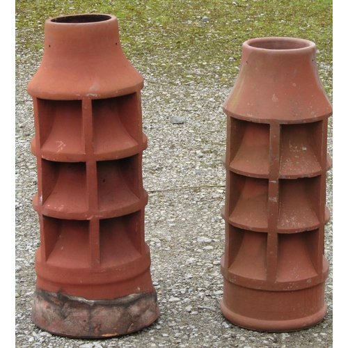 202 - A reclaimed louvre vented cylindrical chimney pot with drawn neck 81 cm high, together with a simila... 