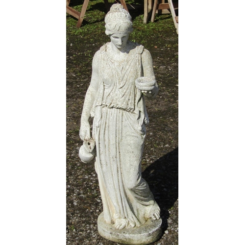 204 - A weathered cast composition stone ornament in the form of a classical standing maiden holding out a... 