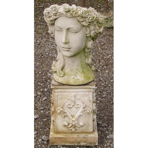 206 - A weathered cast composition stone novelty female head planter raised on a low associated square ped... 