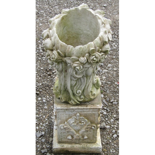 206 - A weathered cast composition stone novelty female head planter raised on a low associated square ped... 