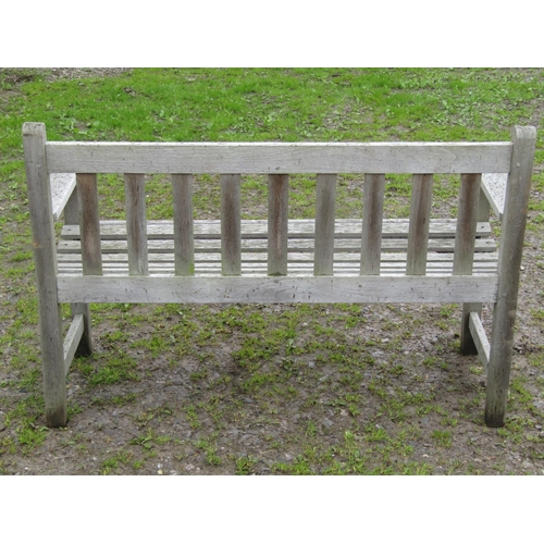 38 - A vintage weathered/silvered teak two seat garden bench with slatted seat and back, probably a Liste... 