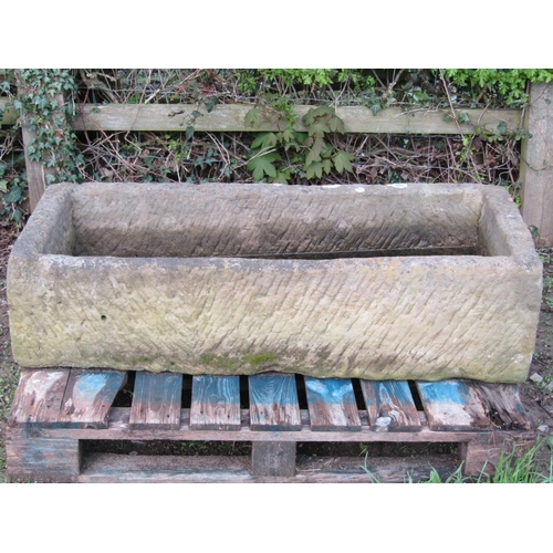 57 - A good weathered thick walled rectangular natural stone trough with corner drainage hole 125 cm long... 