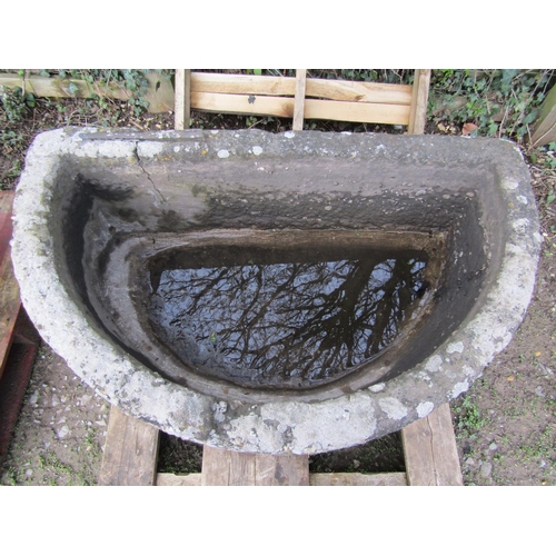 59 - A good weathered thick walled D shaped natural stone trough (af old repair), 112 cm wide x 68 cm dee... 