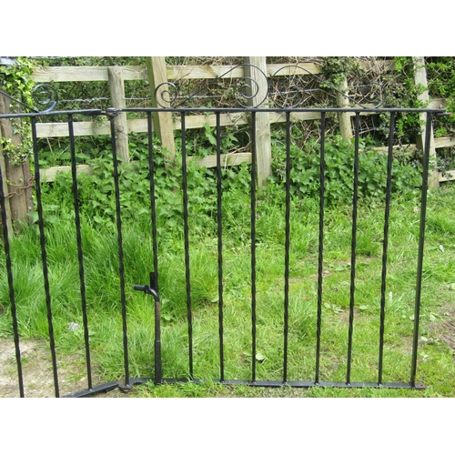 72 - A pair of unusual hinged folding iron work driveway entrance gates with twisted vertical bars and op... 