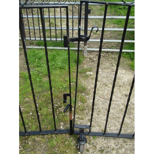 72 - A pair of unusual hinged folding iron work driveway entrance gates with twisted vertical bars and op... 