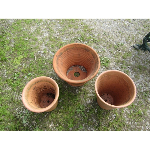 74 - Three terracotta ribbed planters of various size and design, the largest example 47 cm in diameter x... 