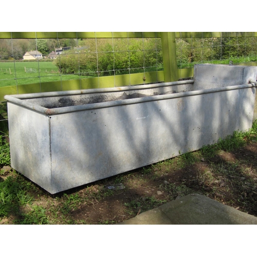 79 - A galvanised steel rectangular field water trough with raised box cistern, (af) 186cm long x 48cm wi... 