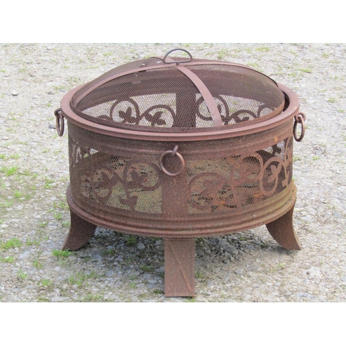 86 - A weathered light steel/aluminium garden brazier/firepit of squat cylindrical form with loose domed ... 