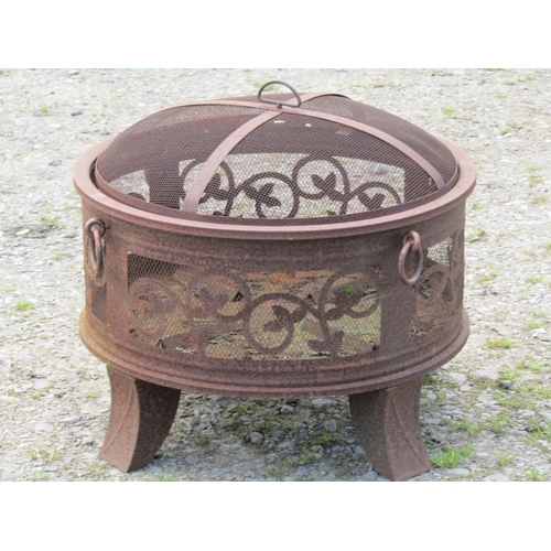 86 - A weathered light steel/aluminium garden brazier/firepit of squat cylindrical form with loose domed ... 