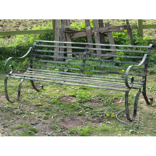 93 - A good quality heavy gauge sprung steel garden bench with strap work seat, open scrolled arms and pa... 