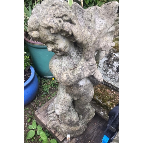 68 - A nicely weathered cast composition stone garden water feature in the form of a standing cherub clut... 