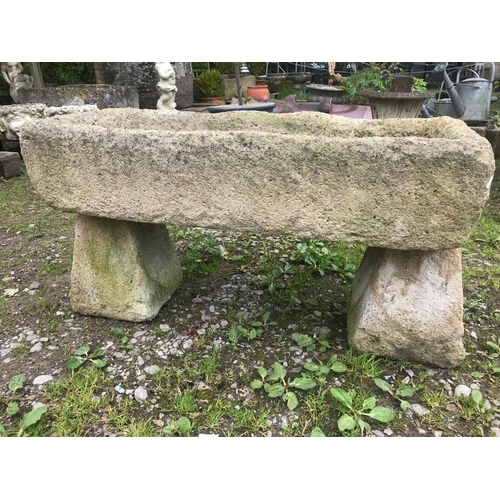 85 - A weathered rectangular reconstituted stone trough, raised on a pair of tapered supports, 93cm long ... 