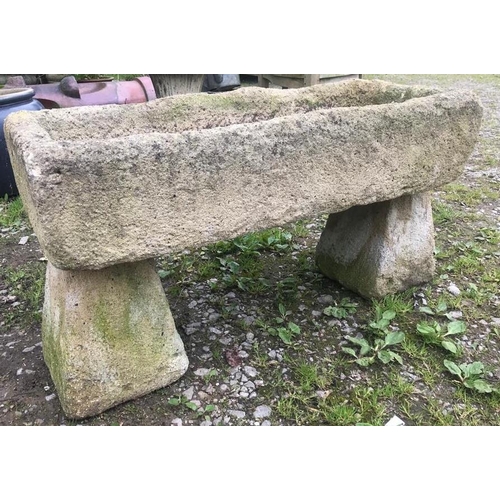 85 - A weathered rectangular reconstituted stone trough, raised on a pair of tapered supports, 93cm long ... 