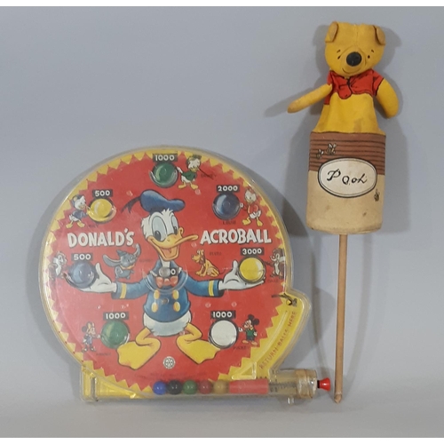 1282 - 2 Walt Disney vintage toys comprising Winnie the Pooh and the honeypot push up puppet designed by An... 