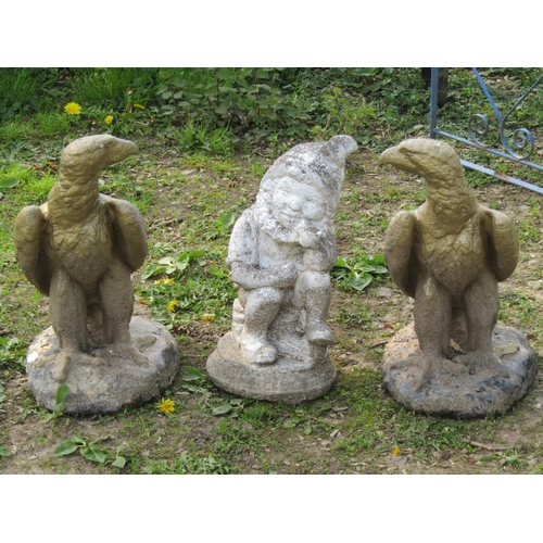 111 - A pair of painted and weathered cast composition stone garden or pier ornaments in the form of eagle... 