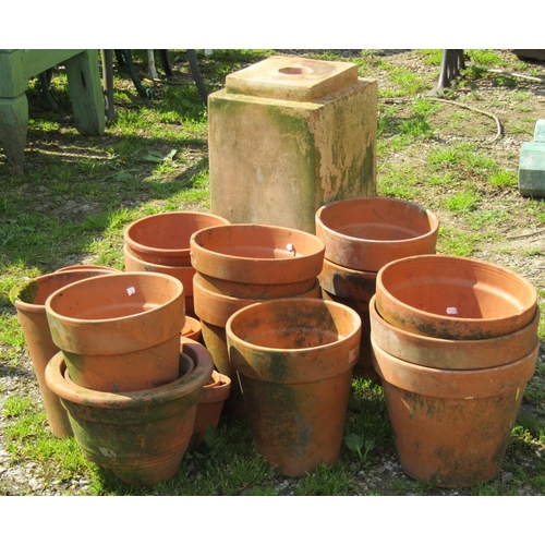 144 - A weathered square stepped urn pedestal 27 cm square x 61 cm high, together with a quantity of terra... 