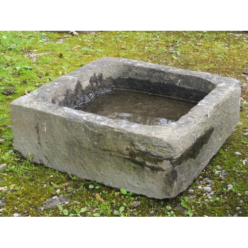 208 - A square weathered natural stone shallow trough with square central drain, 50 cm square x 18 cm high... 