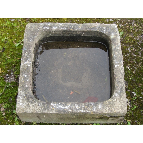 208 - A square weathered natural stone shallow trough with square central drain, 50 cm square x 18 cm high... 