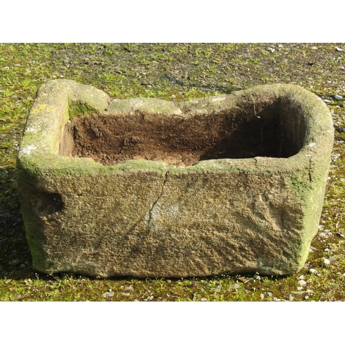 211 - A weathered natural stone rectangular trough with single curved end 77 cm long x 56 cm wide x 32 cm ... 