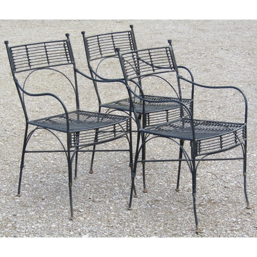 216 - A set of three heavy gauge iron work garden open armchairs with x framed stretchers