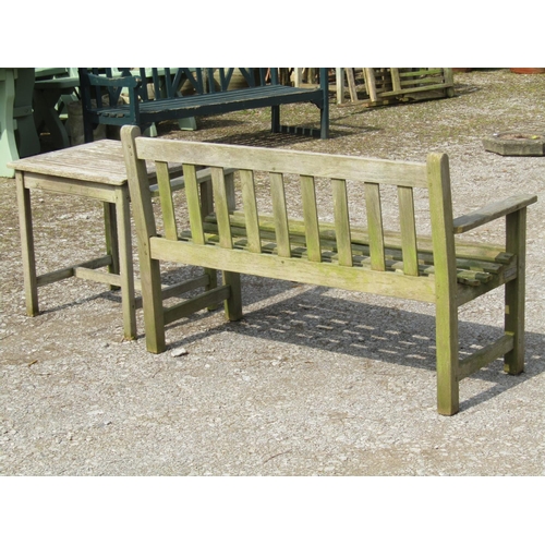 230 - A Jonelle weathered teak two seat garden bench with slatted seat and back, 124 cm wide together with... 