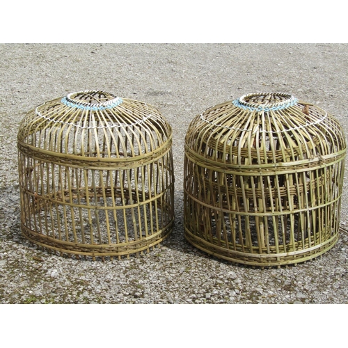 233 - Four Indonesian domed cylindrical chicken coops (graduated in size, the largest approximately 70 cm ... 