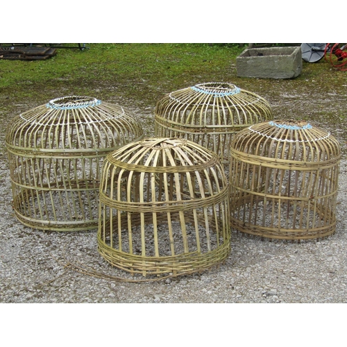 233 - Four Indonesian domed cylindrical chicken coops (graduated in size, the largest approximately 70 cm ... 