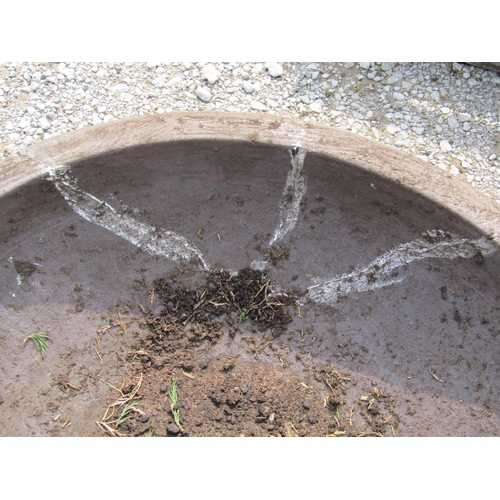 249 - A large matt glazed terracotta planter with circular shallow bowl raised on a loose socle, 90 cm dia... 