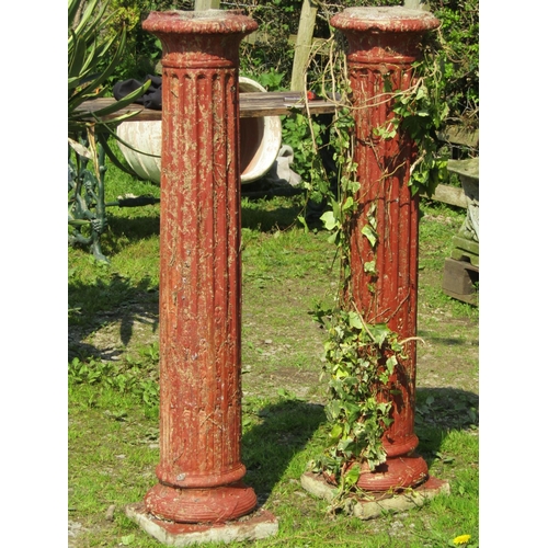 70 - A pair of painted and weathered cast composition stone classical style fluted cylindrical pedestals ... 