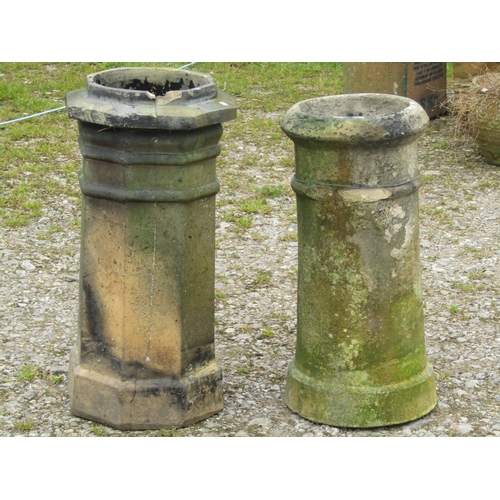 84 - A weathered buff coloured octagonal chimney pot together with a further cylindrical example (2) (af)