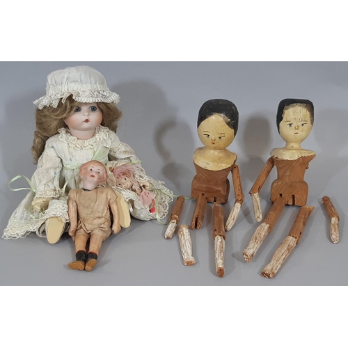 1290 - Four dolls including 2 19th century Grödnertal 'Penny Wooden' dolls with Gesso faces, painted black ... 