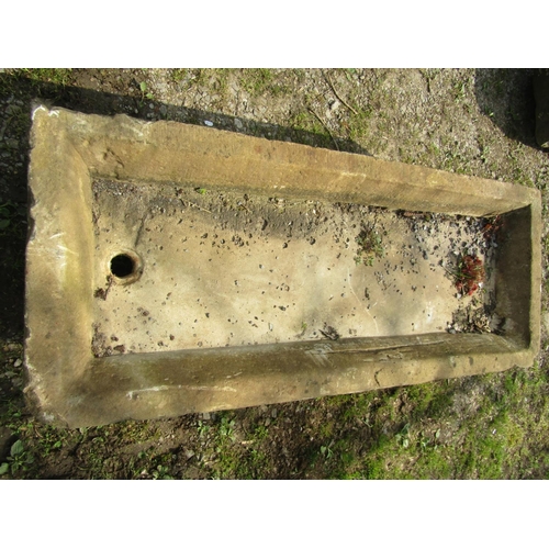 104 - A shallow rectangular but thick walled natural stone sink/trough, with rounded front corners and sin... 