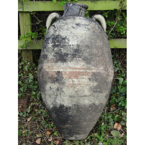 219 - Two large weathered olive jars of varying design, one with banded detail, (af) 1 metre high approxim... 