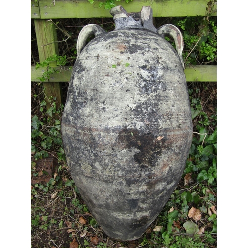 219 - Two large weathered olive jars of varying design, one with banded detail, (af) 1 metre high approxim... 