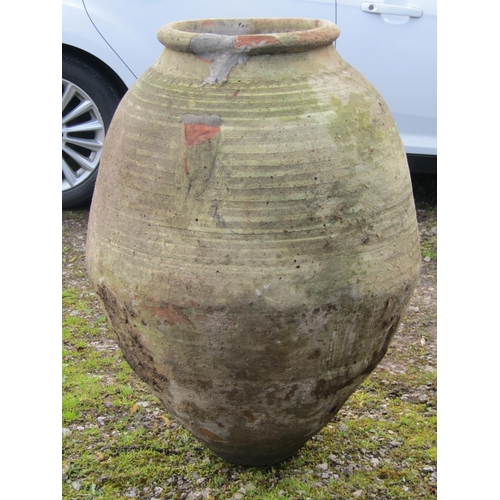 219 - Two large weathered olive jars of varying design, one with banded detail, (af) 1 metre high approxim... 