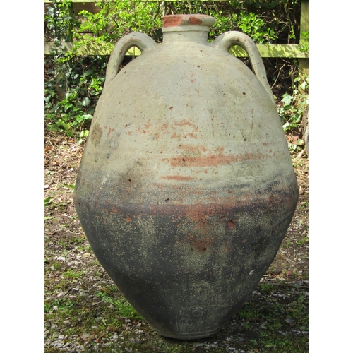 220 - Two similar weathered buff coloured terracotta jars with moulded loop handles and incised collars (a... 