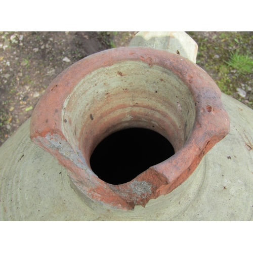 220 - Two similar weathered buff coloured terracotta jars with moulded loop handles and incised collars (a... 