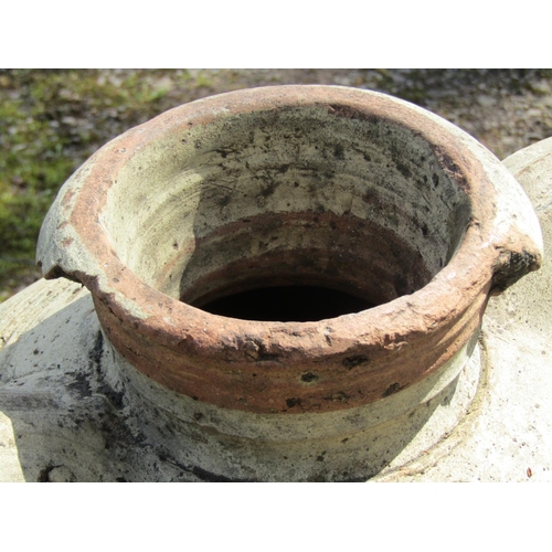 220 - Two similar weathered buff coloured terracotta jars with moulded loop handles and incised collars (a... 