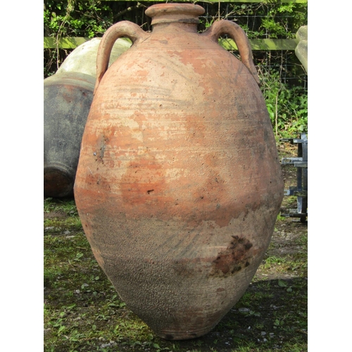 221 - Two similar weathered terracotta jars with reeded collars (af) slight variation in height, the large... 