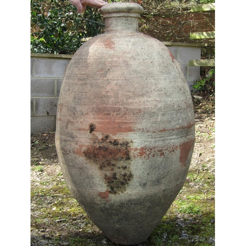 221 - Two similar weathered terracotta jars with reeded collars (af) slight variation in height, the large... 