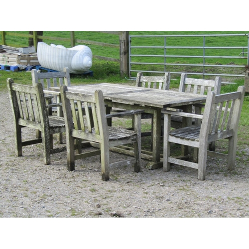 96 - A weathered Gloster teak garden table with rectangular slatted panelled top, raised on rectangular c... 