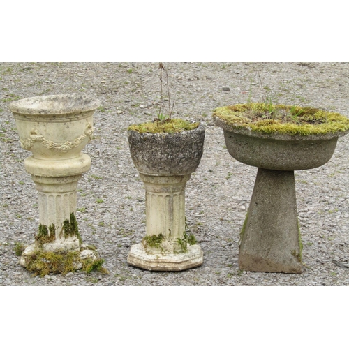 148 - Three weathered cast composition stone circular planters raised on squat pedestals (varying size and... 