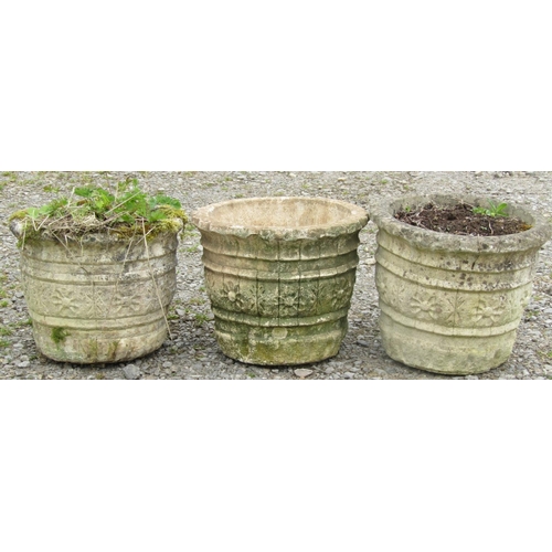 150 - A set of three weathered cast composition stone circular tapered garden planters with repeating reli... 