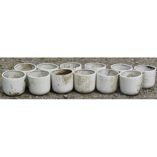 152 - Twelve cream glazed squat cylindrical plant pots 22 cm diameter x 20 cm high, together with two othe... 