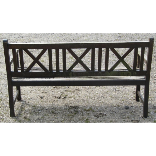 99 - A Claire Collection weathered hardwood three seat garden bench with slatted seat and X framed panell... 