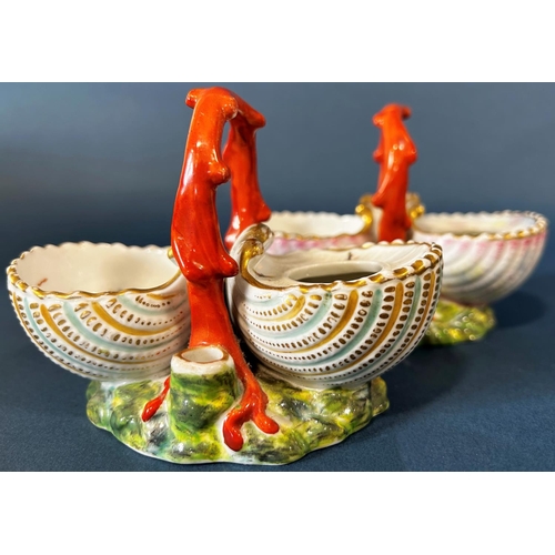 2009 - A pair of 19th century continental porcelain dishes on a marine theme, shell shaped bowls, coral lik... 