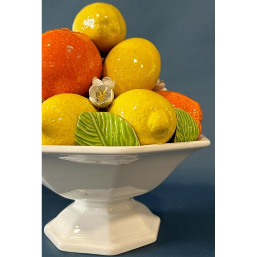 2017 - An Italian porcelain table centre in the form of an octagonal basket laden with oranges and lemons