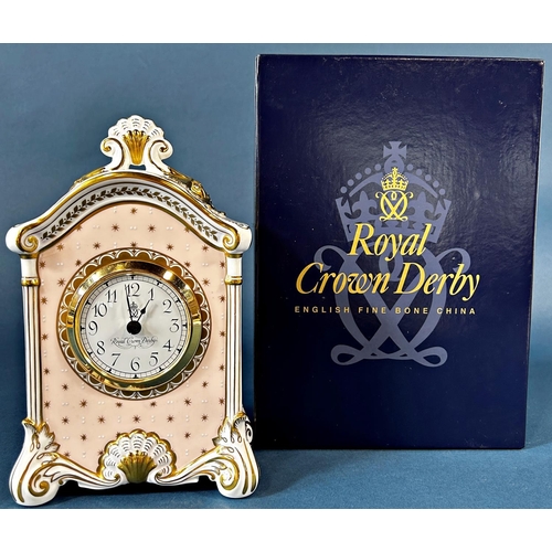 2038 - A Royal Crown Derby bone china mantle clock with hand painted panels to all sides with quartz moveme... 